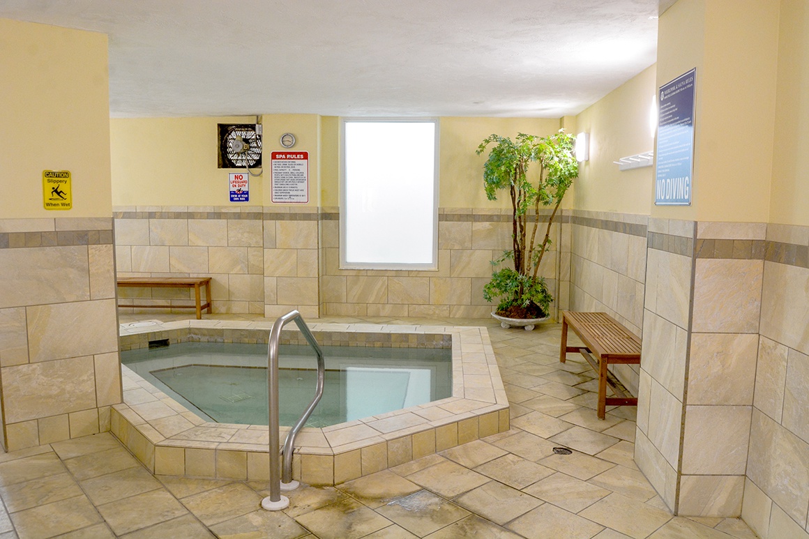 Unwind in your private hot tub sanctuary, where warm waters and peaceful greenery create the perfect retreat after your adventures.