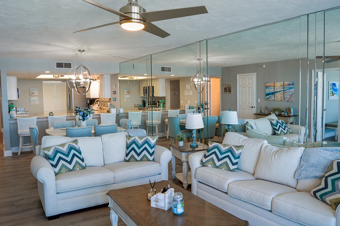 Sink into coastal comfort in your open-plan living area, where soft furnishings and ocean-inspired décor create the perfect retreat.