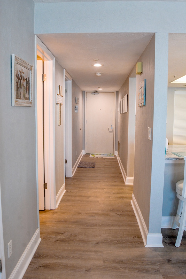 Step into your welcoming hallway with warm hardwood floors and thoughtful artwork adorning the walls.