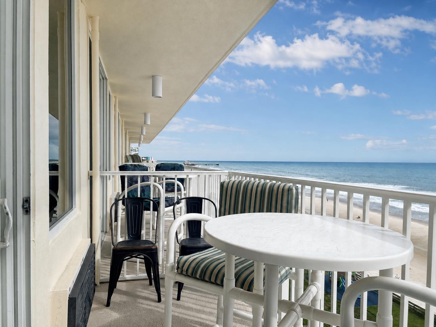 Step onto your private balcony and let the ocean breeze sweep over you. Pull up a chair, take in endless sea views, and feel the sand and surf just steps away from your retreat.