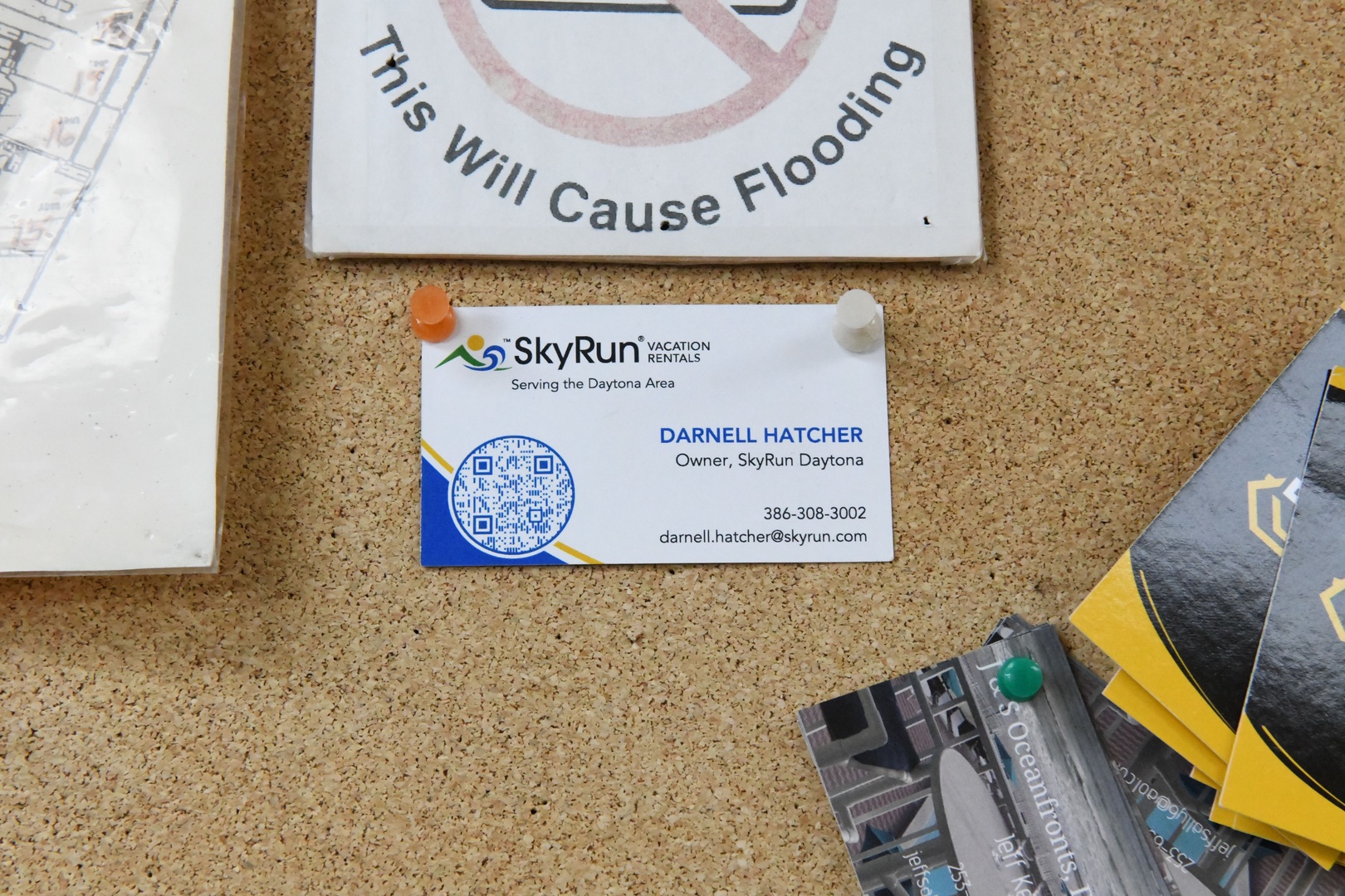 SkyRun Vacation Rentals serves the Daytona Area, with owner contact information displayed on the property's business card.