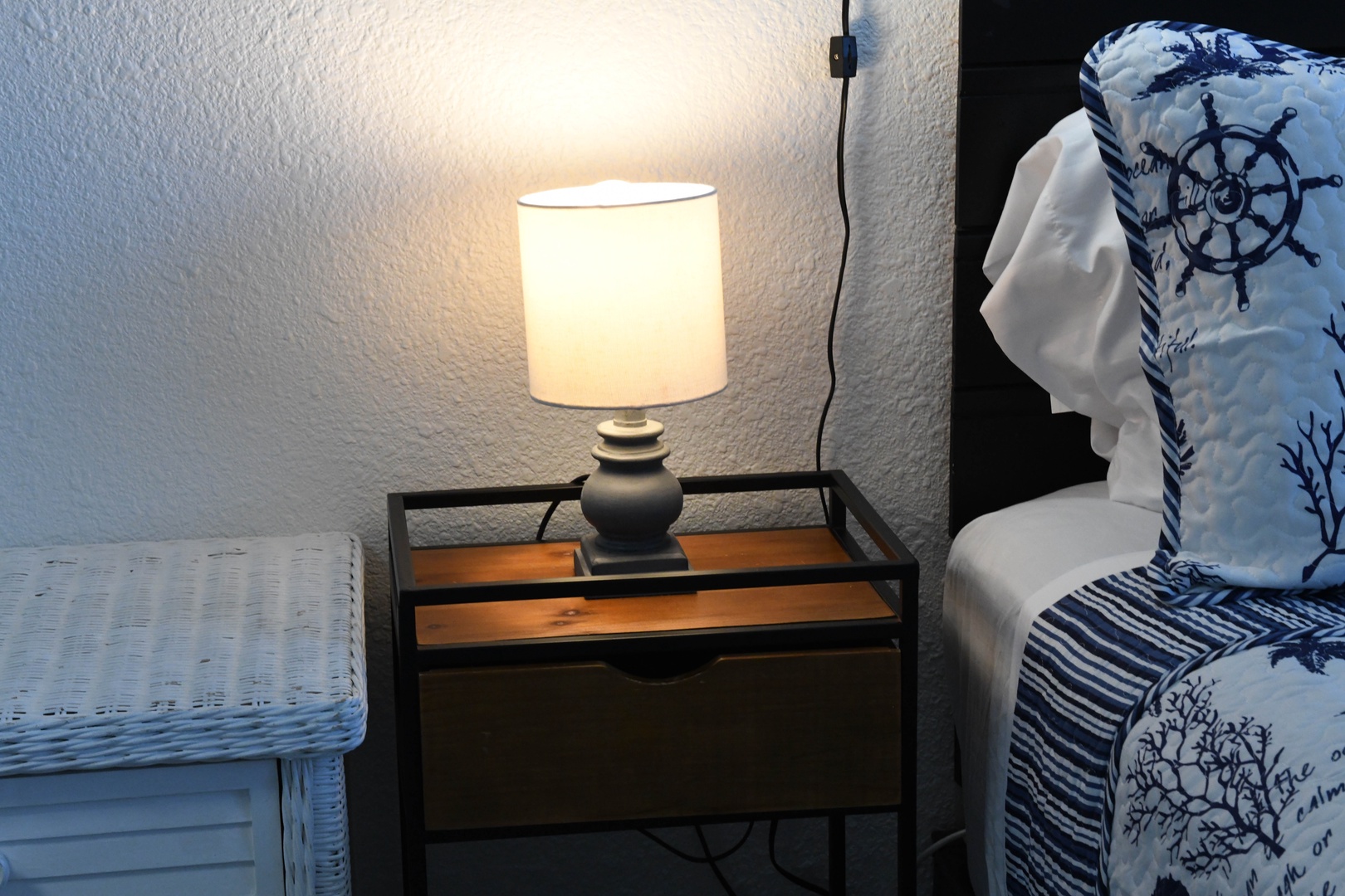 Relax in your cozy coastal-themed corner with soft lighting and nautical accents that invite you to unwind after a day of exploring.