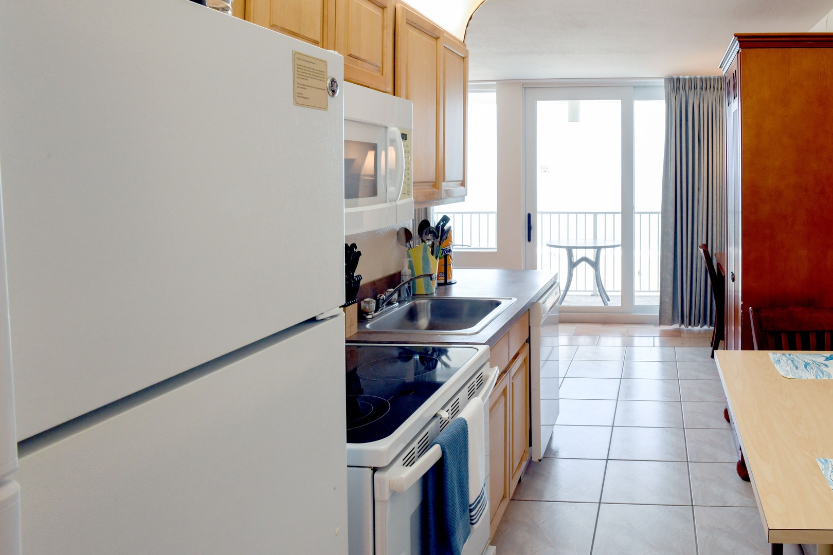 Your fully equipped kitchen offers everything you need to prepare meals at your leisure, opening to a bright living space with a private balcony for memorable mornings.