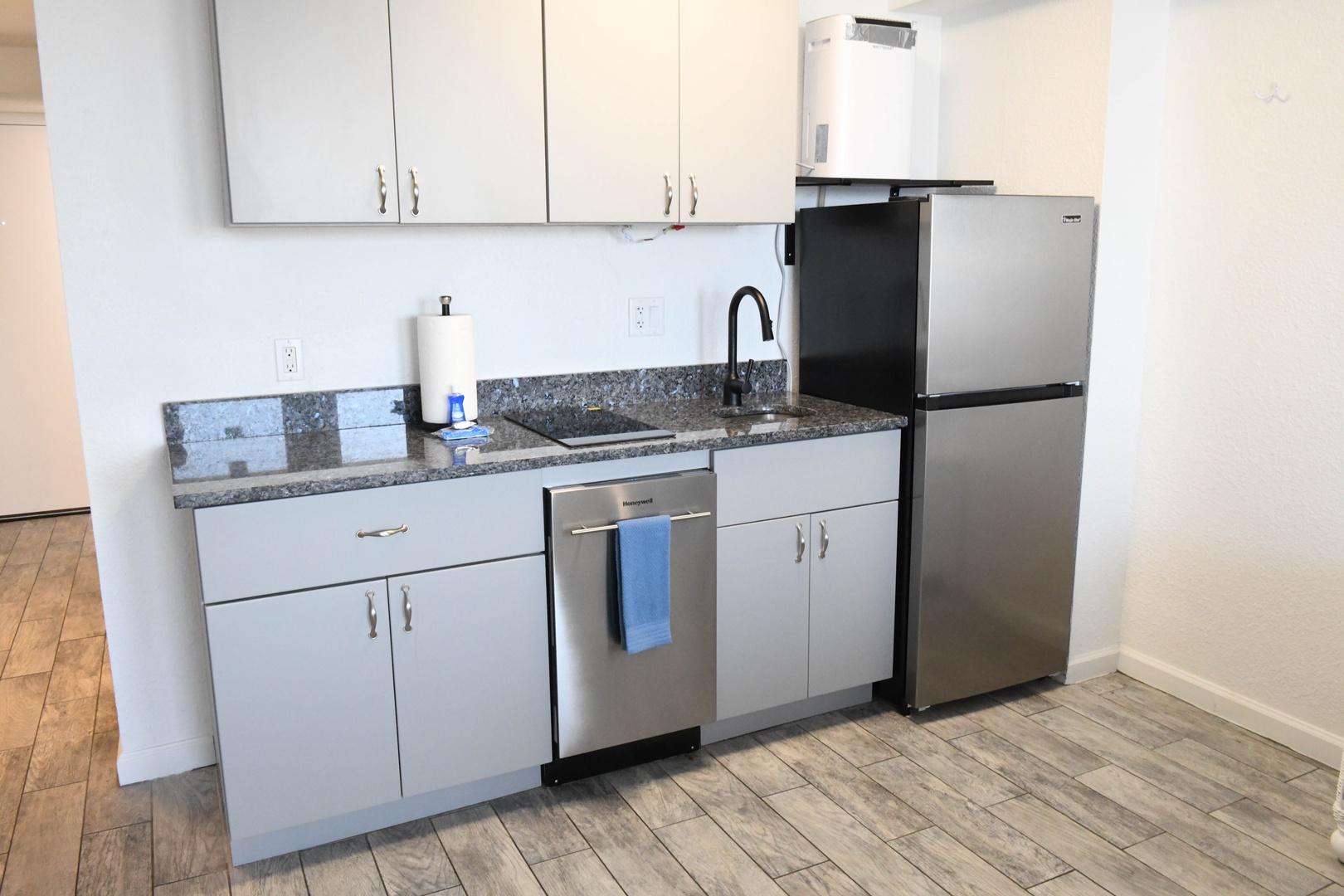 Step into your fully equipped kitchenette with modern stainless steel appliances, granite counters, and everything you need to prepare your favorite meals during your stay.