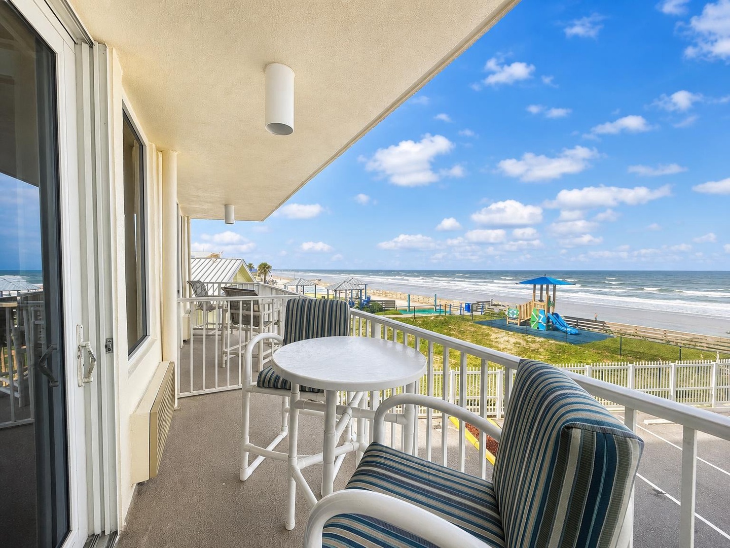 Step onto your private balcony and soak in sweeping oceanfront views. Relax in cushioned seating while listening to the waves and enjoying the coastal breeze—your perfect spot for morning coffee or sunset moments.