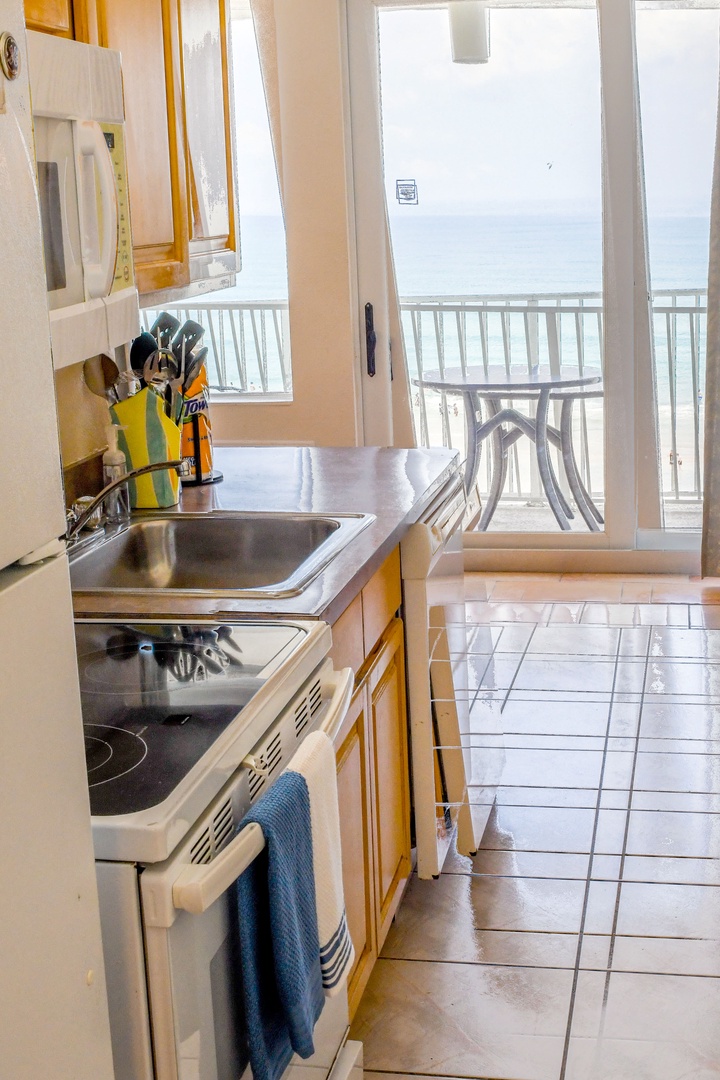 Your kitchenette opens onto a balcony with sweeping sea views—perfect for morning coffee overlooking the ocean.