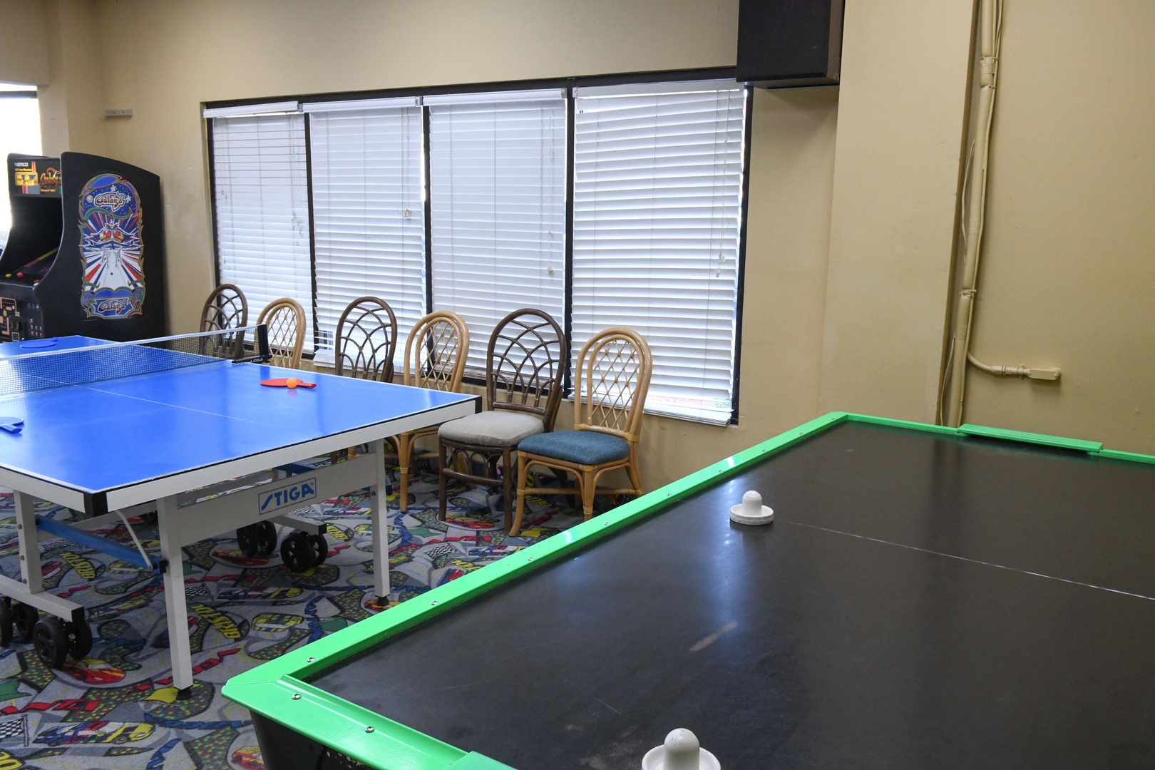 Challenge your travel companions to ping pong, air hockey, or classic arcade games in this vibrant game room—perfect for friendly competition and fun-filled evenings together.