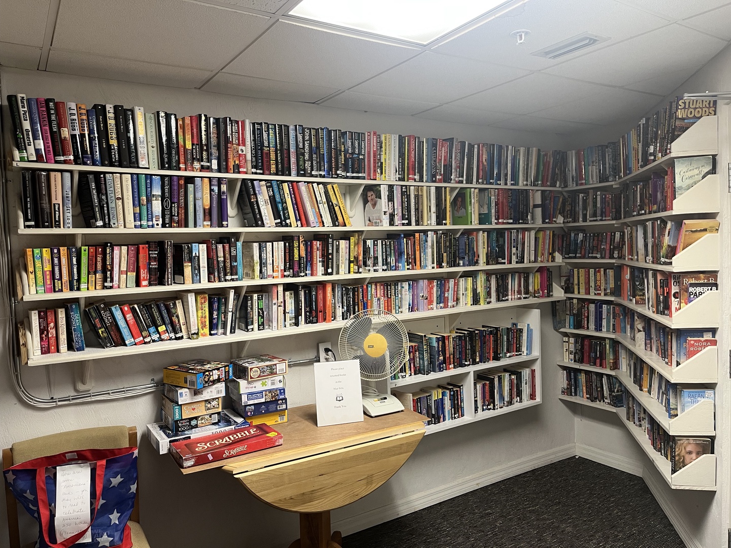 Curl up with your favorite book in this incredible personal library featuring hundreds of novels spanning every shelf.