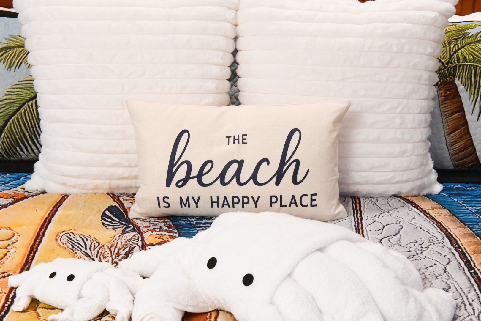 You'll love relaxing in this cozy beach-themed bedroom, complete with a plush quilted headboard, soft textured bedding, and charming seaside décor to help you unwind.