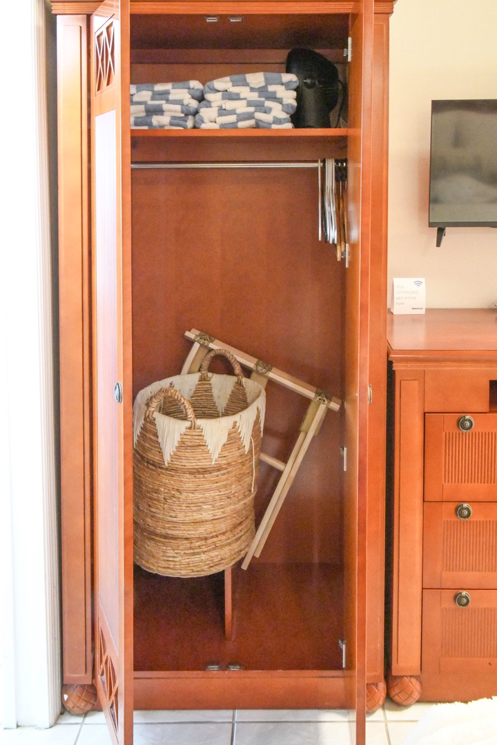 Store your belongings in this thoughtfully designed closet with ample hanging space and upper shelving for linens and personal items.