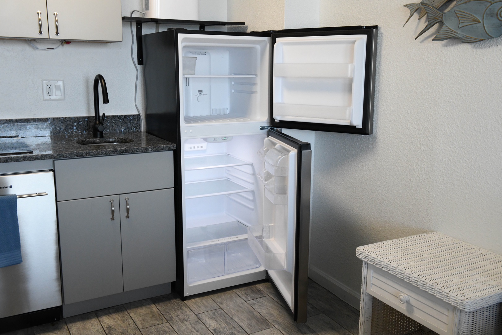 A full-size refrigerator with freezer ensures you have space to stock your favorite snacks and keep drinks cold throughout your stay.