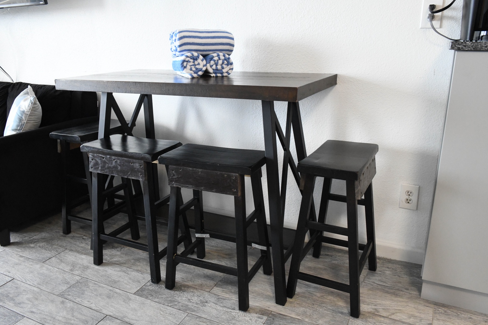 Enjoy casual meals at your sleek breakfast bar with seating for three, perfect for morning coffee or quick bites throughout your stay.