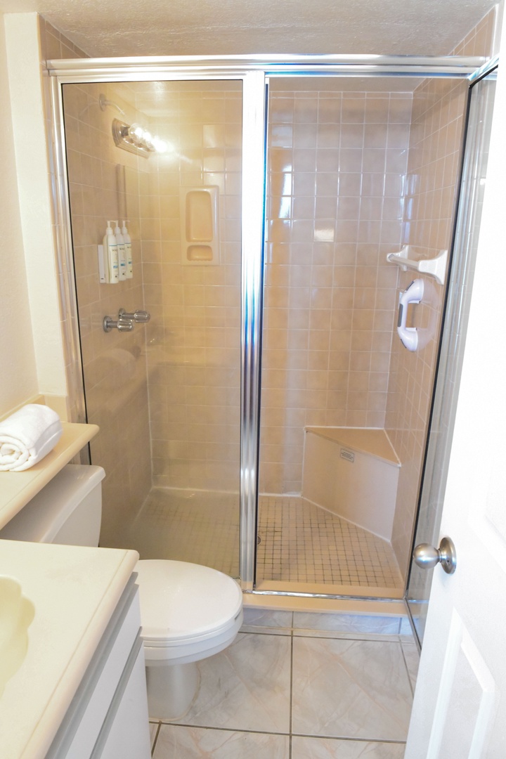 Step into your private bathroom with a spacious walk-in shower.