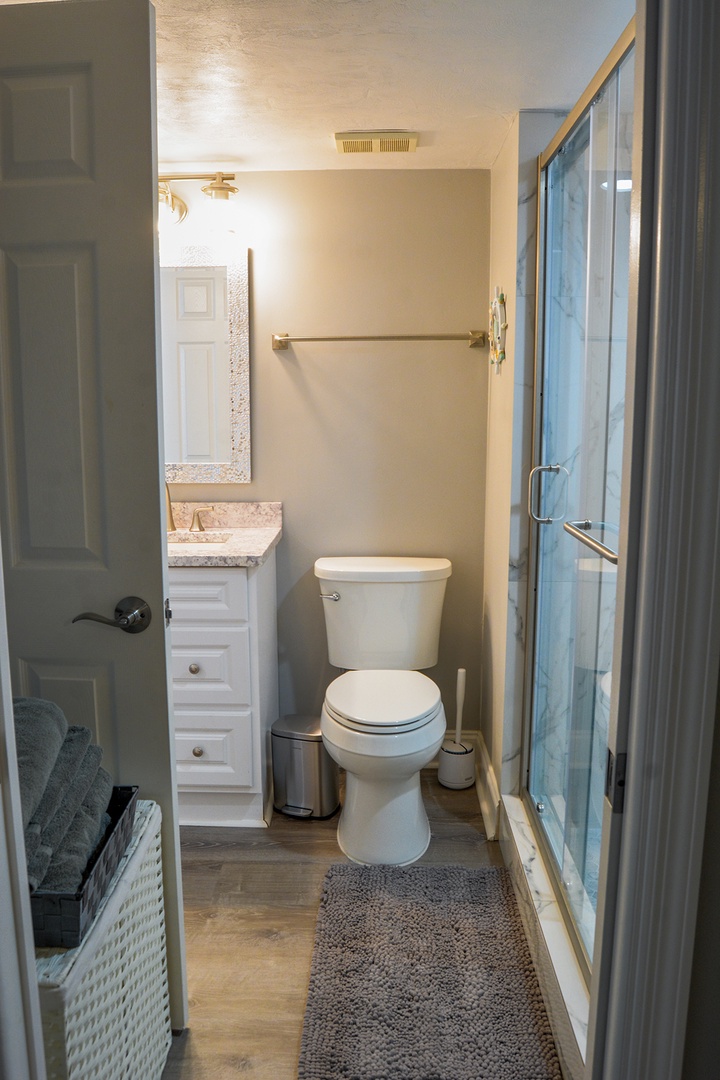 Your private bathroom features modern fixtures with a spacious walk-in shower and granite vanity for comfortable daily routines.