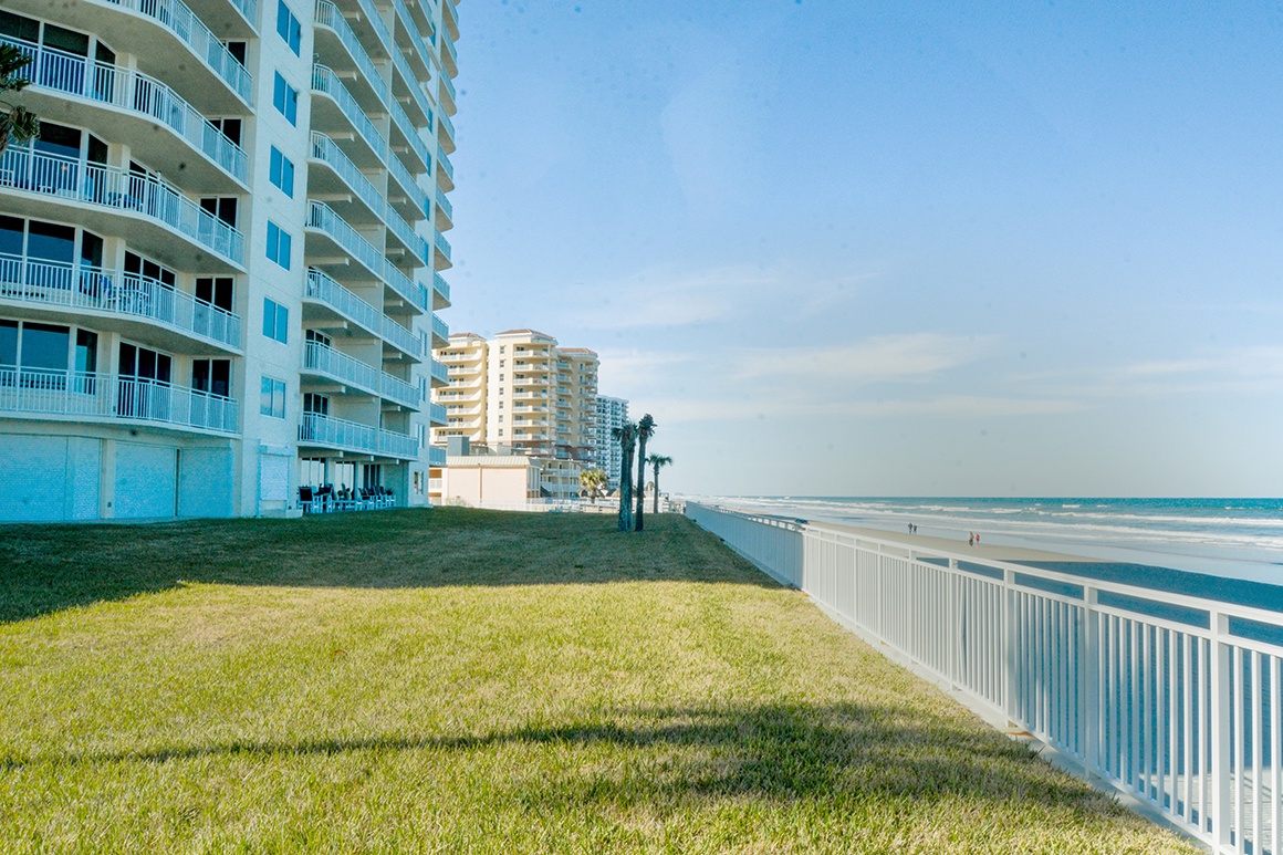 Beachfront property offers direct access to pristine sandy shores and endless ocean views from this coastal community.