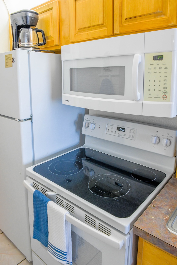 Your fully equipped kitchen has everything you need to cook your favorite meals, with a stove, microwave, coffee maker, and refrigerator at your fingertips.