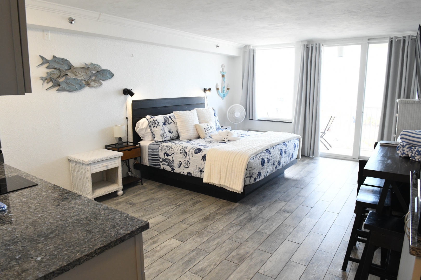 Drift into coastal dreams in your serene bedroom, where nautical touches and natural light invite you to unwind in style.
