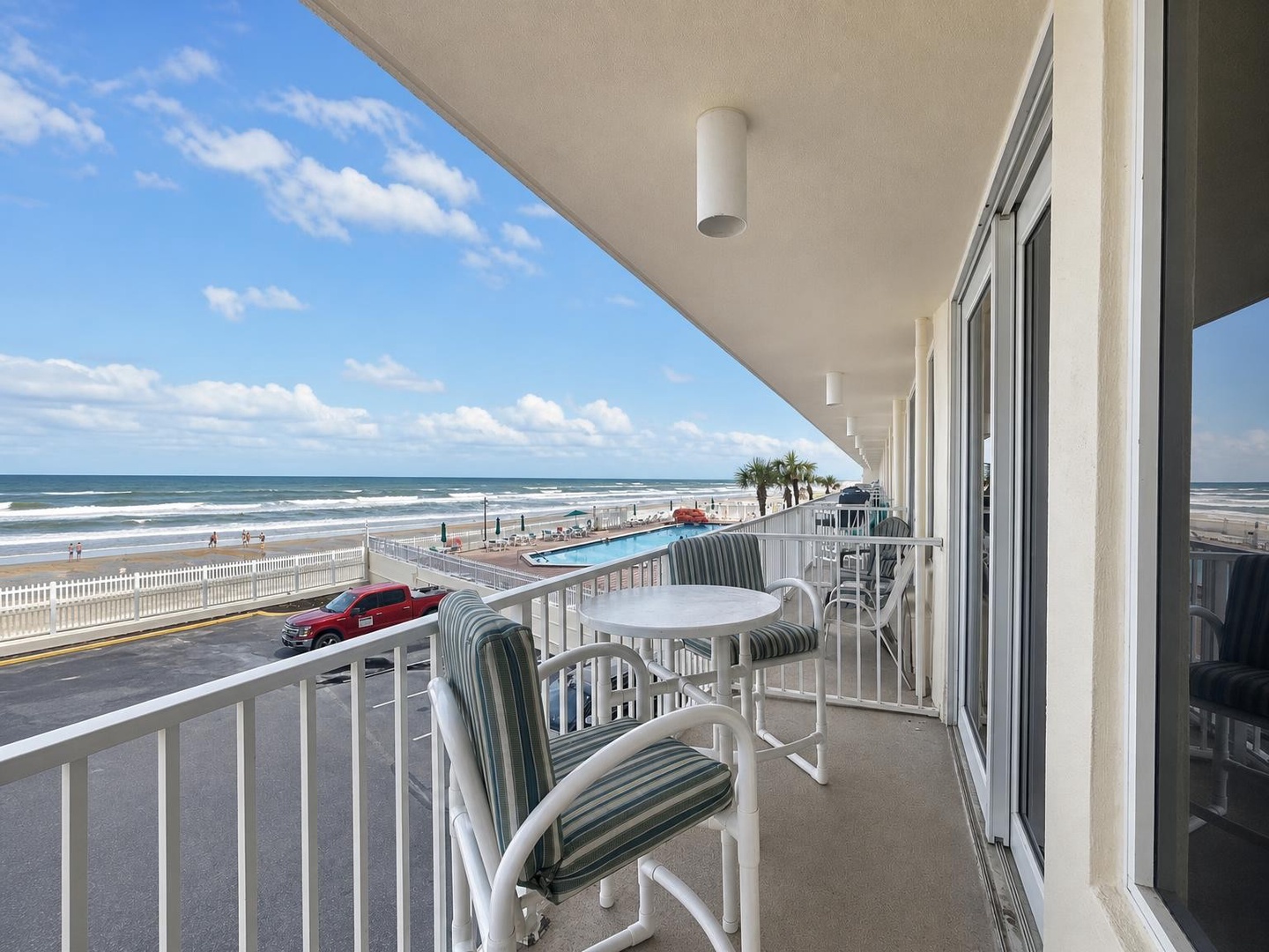 Step out onto your private balcony and savor oceanfront views with the beach just steps away. Relax in your outdoor seating while the sea breeze and coastal sounds surround you.