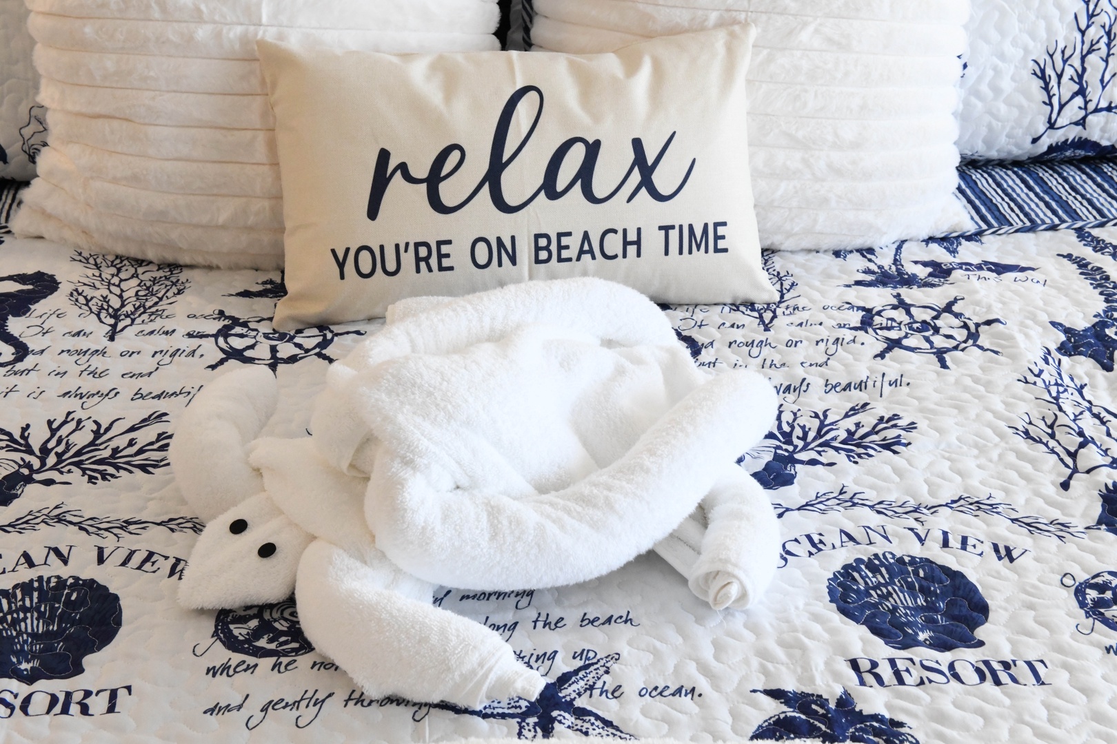 Sink into plush linens and coastal charm as you unwind in your serene beach retreat, where every detail invites you to leave your worries behind.