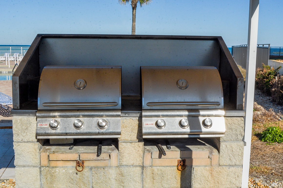 Two premium gas grills await your beachside cookouts, perfectly positioned for seaside dining with ocean breezes.