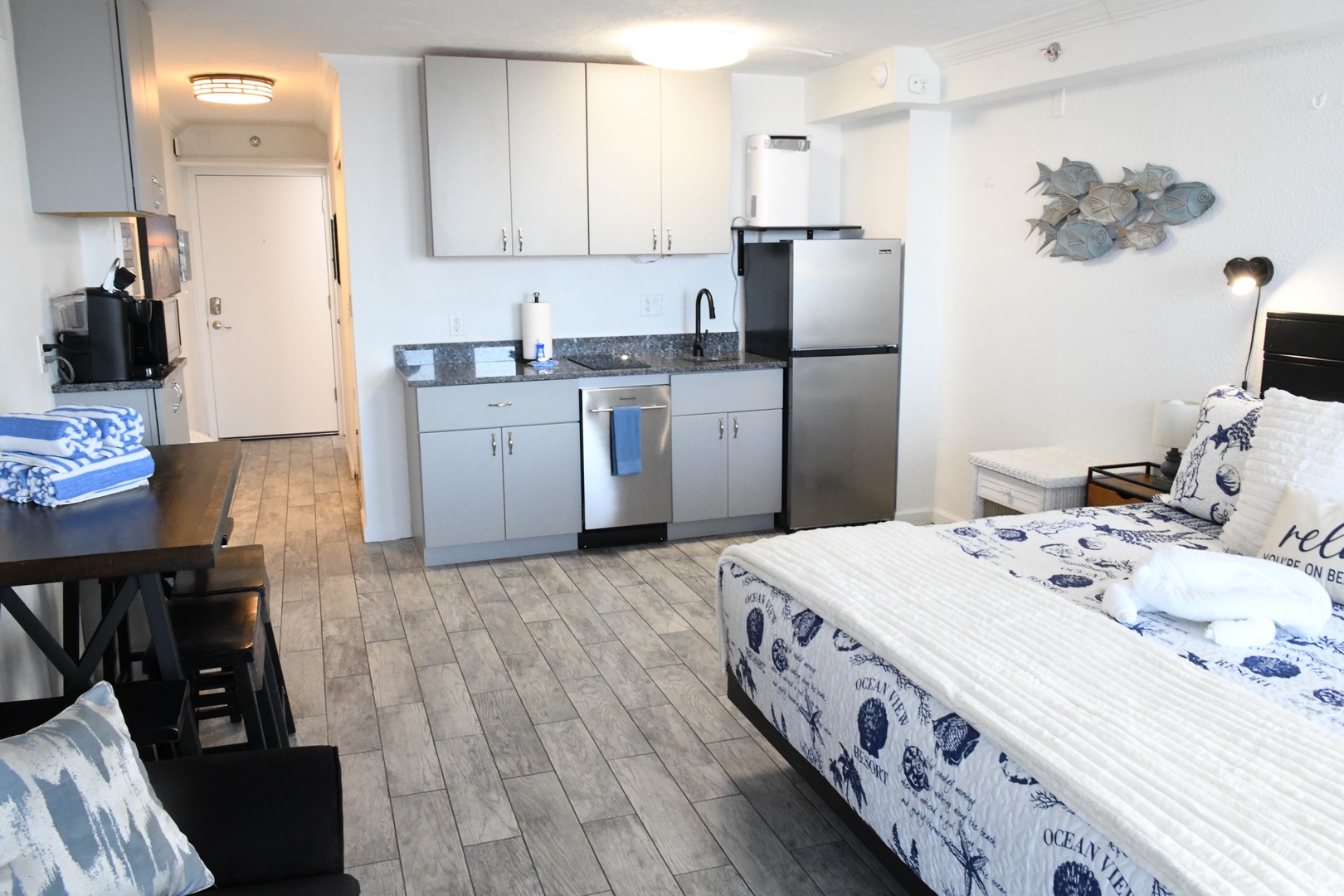 Unwind in your coastal-inspired studio where ocean-themed accents and a fully equipped kitchenette let you feel right at home. Two cozy beds and a dining table make it perfect for your beach retreat.