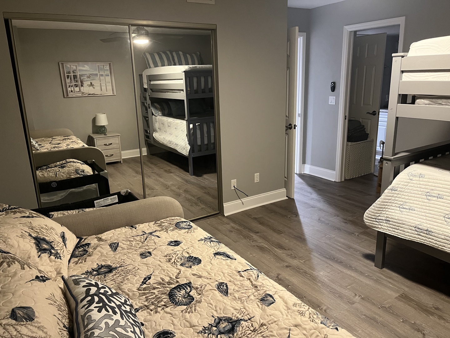 Your spacious bedroom offers comfortable sleeping arrangements with both regular beds and bunk beds, perfect for families or groups traveling together.