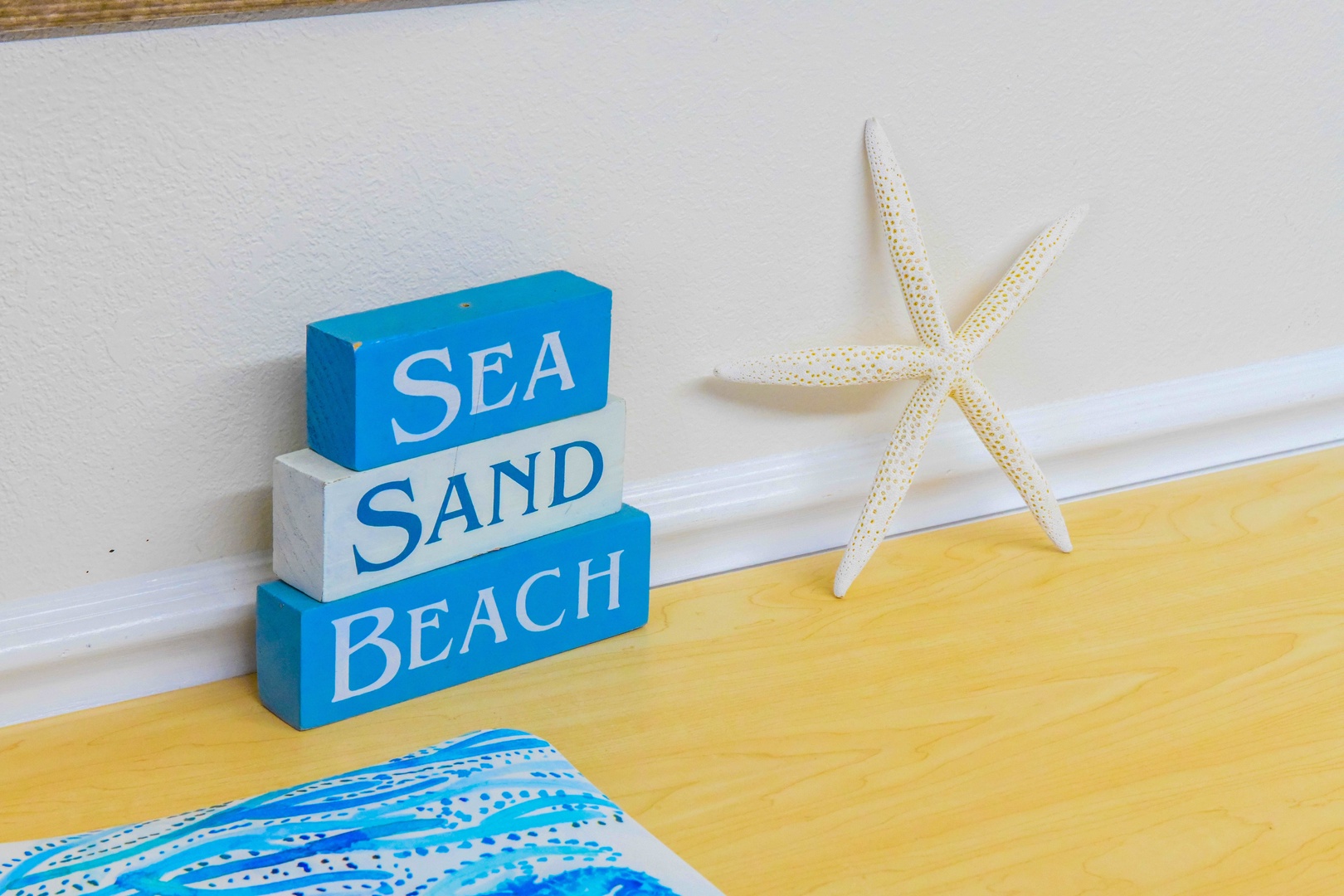 Coastal charm meets your beach retreat with playful décor and a starfish accent that brings the ocean vibe right to your doorstep.