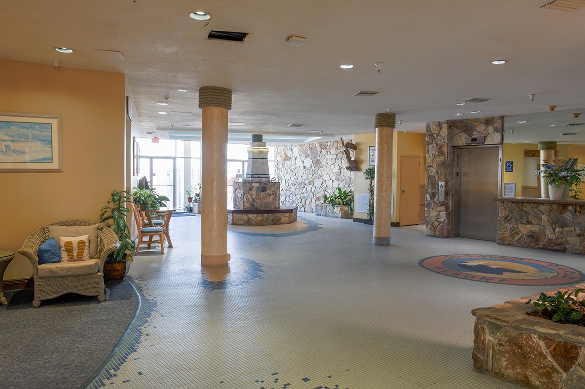 Step into a welcoming lobby with natural stone features, comfortable wicker seating, and warm southwestern charm that sets the tone for your stay.