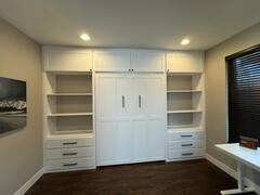 Your spacious bedroom features a sleek wall-to-wall entertainment center with ample storage, perfect for organizing your belongings while enjoying your favorite shows.