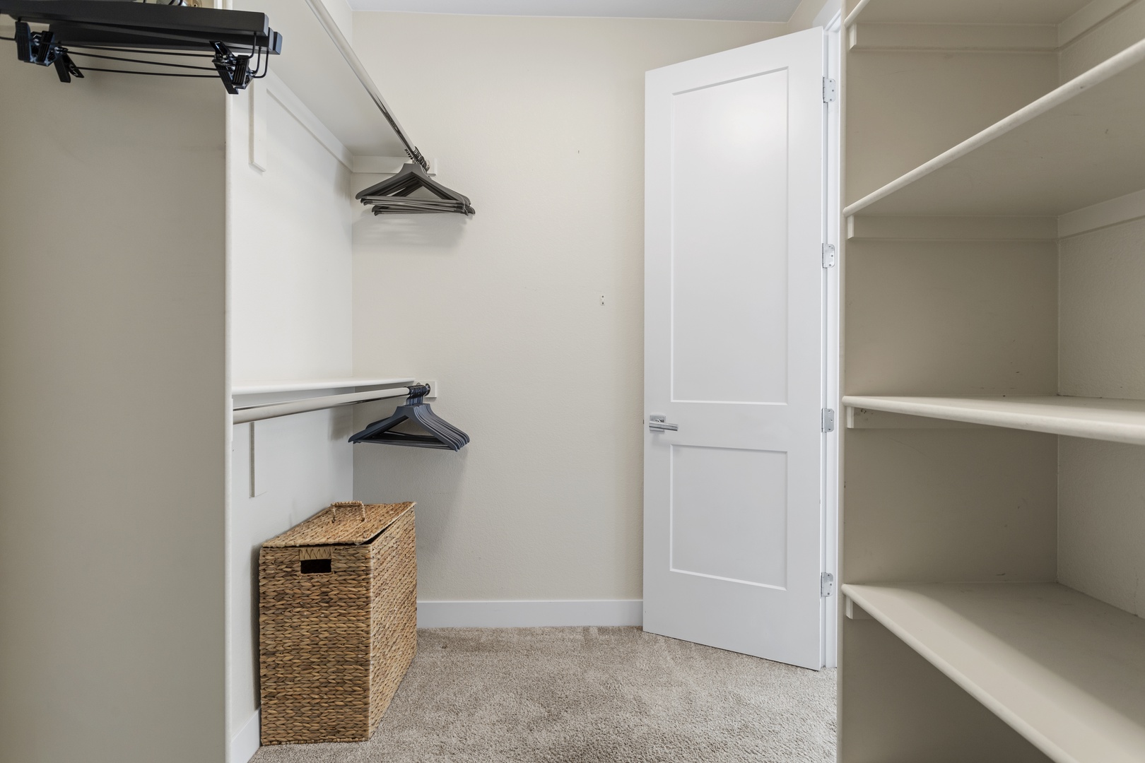 Your spacious walk-in closet features abundant shelving and hanging space to keep all your belongings perfectly organized during your stay.