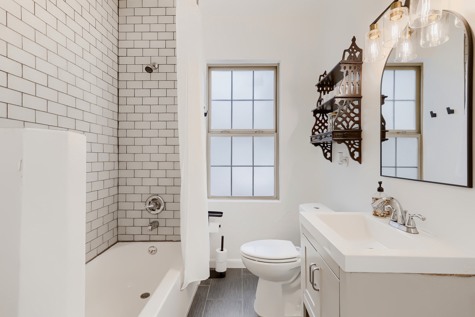 Relax in your private bathroom with classic subway tile, a deep soaking tub, and elegant vintage accents that add character to every refresh.