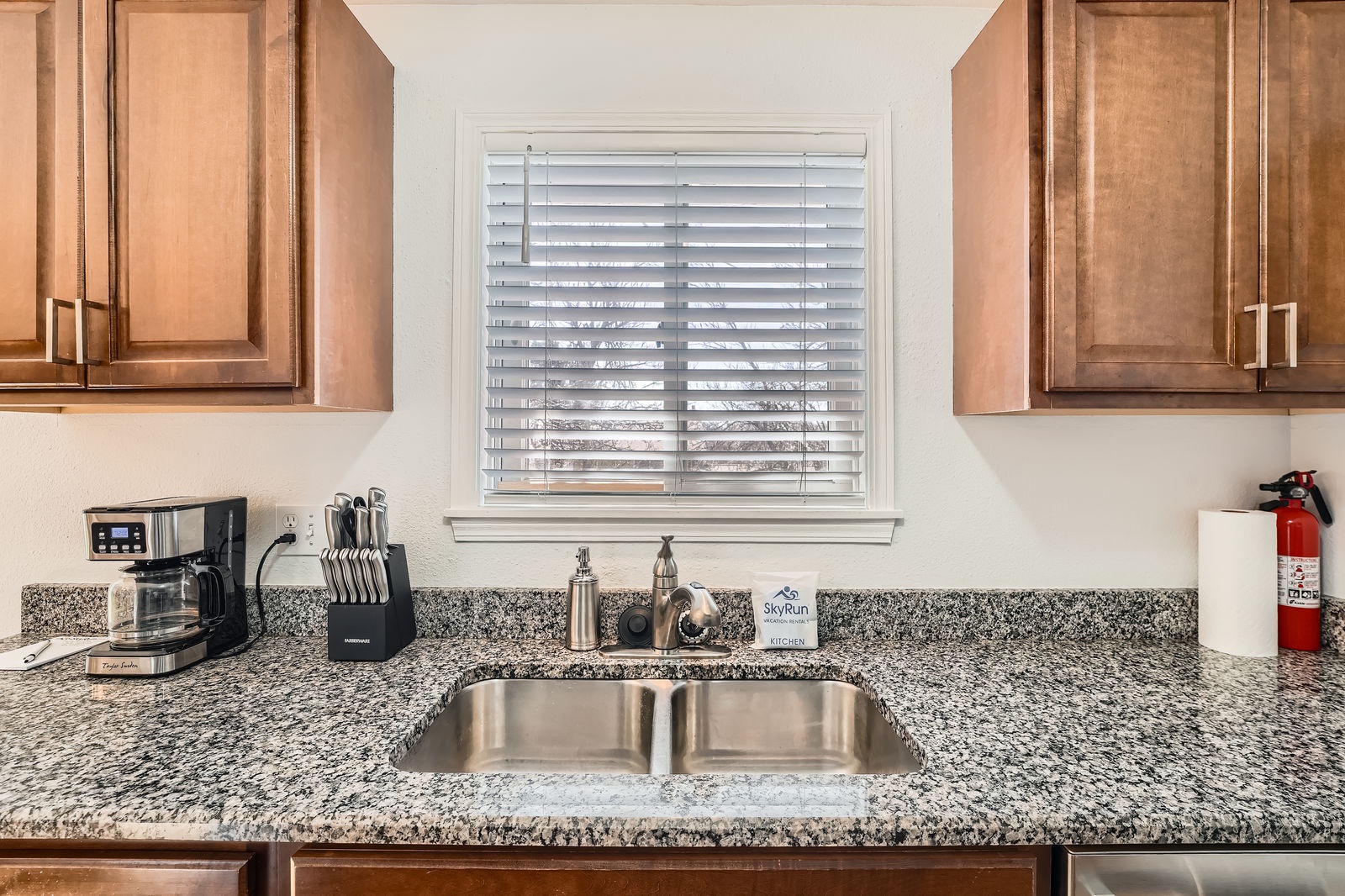 Your fully equipped kitchen features granite countertops, stainless steel sink, and everything you need to prepare meals during your stay.