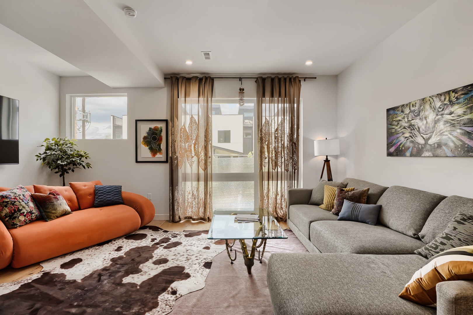 Sink into stylish comfort in your spacious living room, where plush sofas and modern décor create the perfect spot to unwind after a day of exploring.
