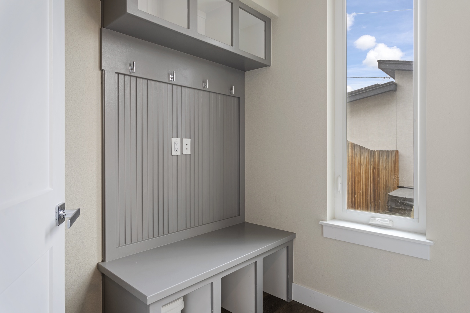 Your organized entry features built-in storage with hooks and shelving, perfect for keeping gear tidy after adventures.