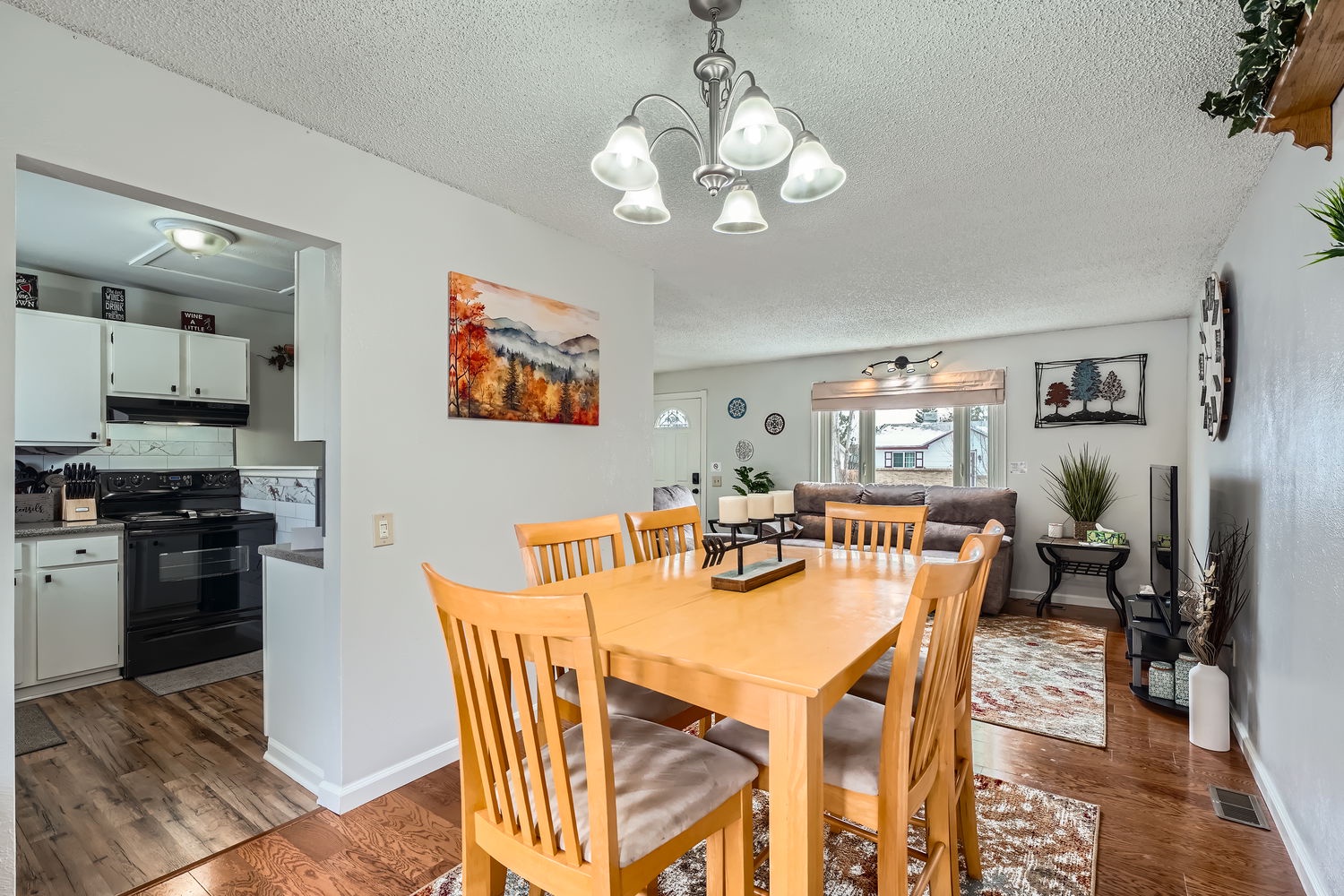Gather around the dining table for meals with loved ones, then relax in the open living room nearby. The kitchen stands ready for your culinary adventures.
