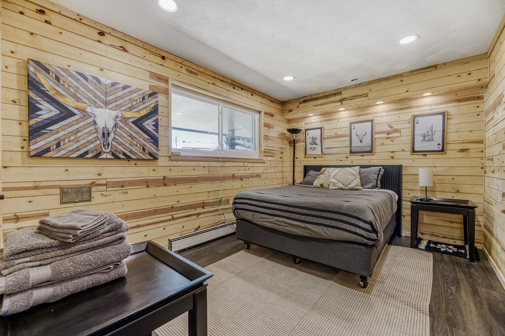 Unwind in your cozy retreat, where rustic pine walls meet modern comfort. Sink into soft linens and let mountain-inspired decor welcome you home.