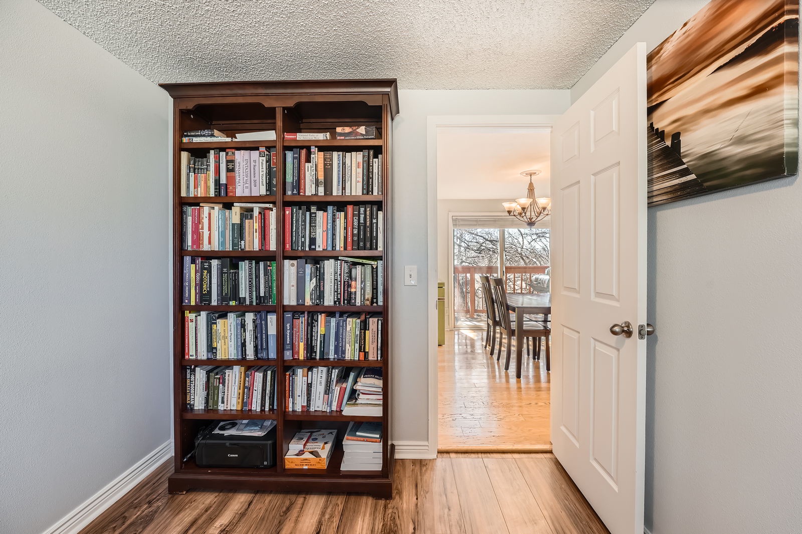 Curl up with your favorite book from this extensive library collection, perfectly positioned for quiet reading moments.