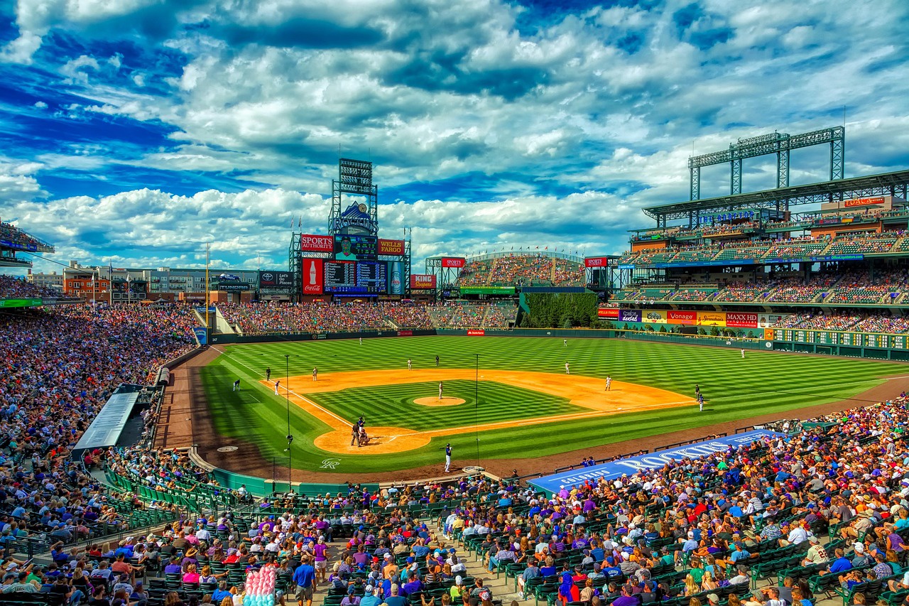 Major League Baseball stadium showcases professional sports venue in the surrounding area with dramatic cloudy skies overhead.
