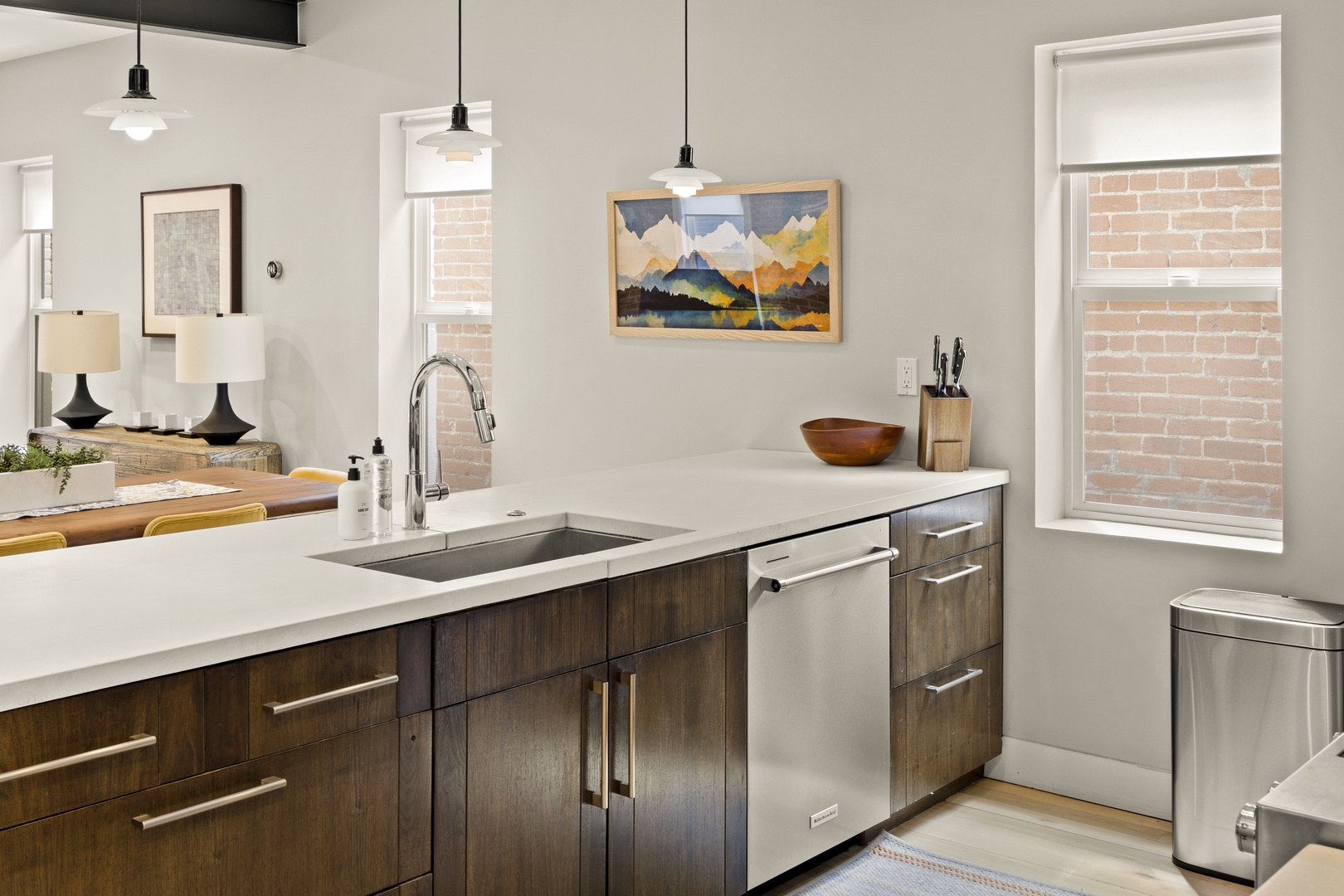 You'll love cooking in this stylish kitchen with sleek granite counters, stainless appliances, and warm pendant lighting creating the perfect culinary retreat.