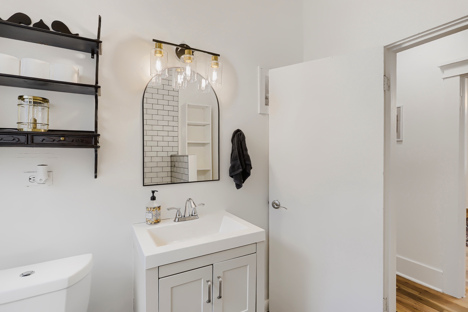 Your private bathroom features modern fixtures, stylish vanity storage, and crisp white finishes to ensure a refreshing start to each day of your stay.