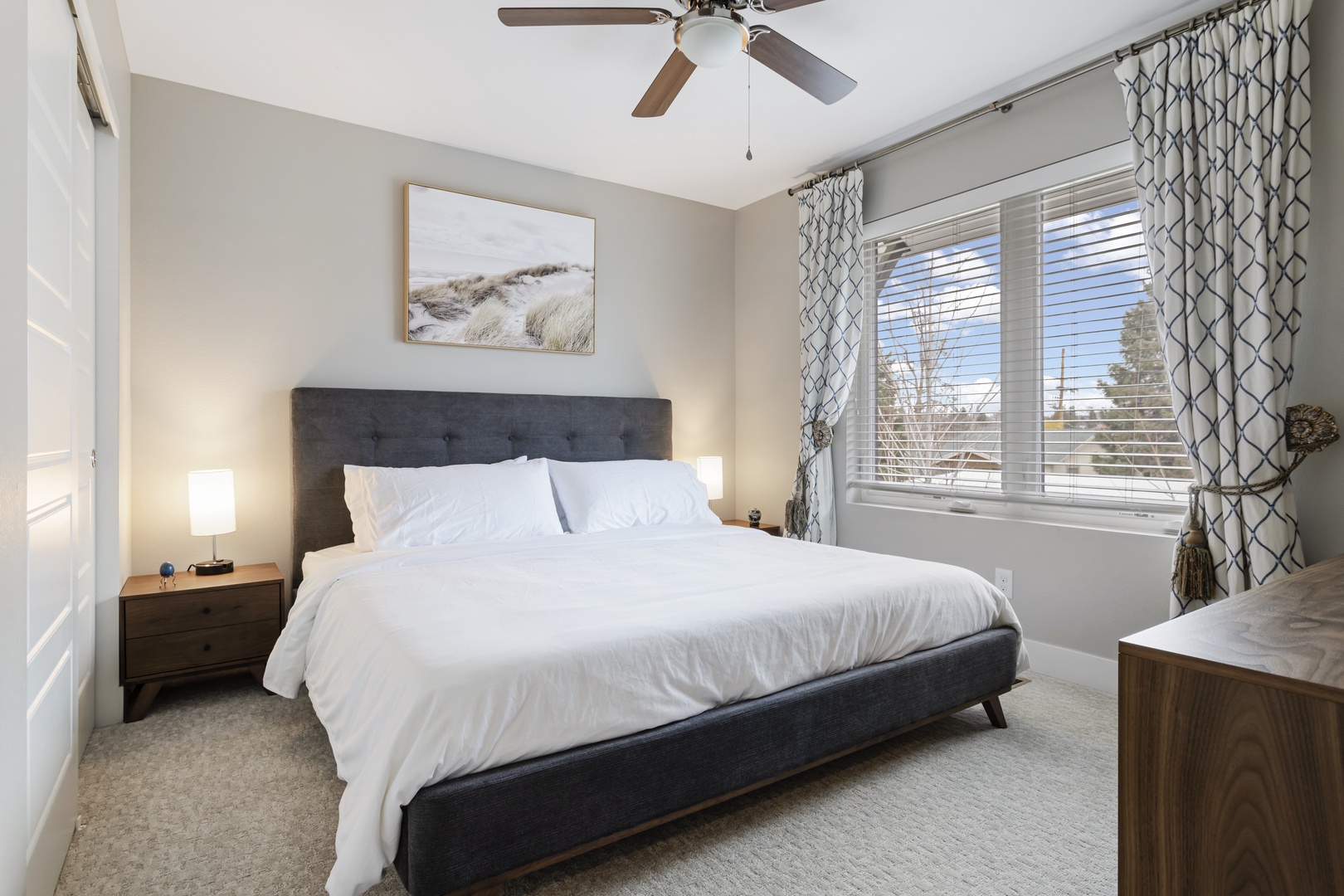 Sink into crisp white linens and wake to soft natural light filtering through your private bedroom windows.