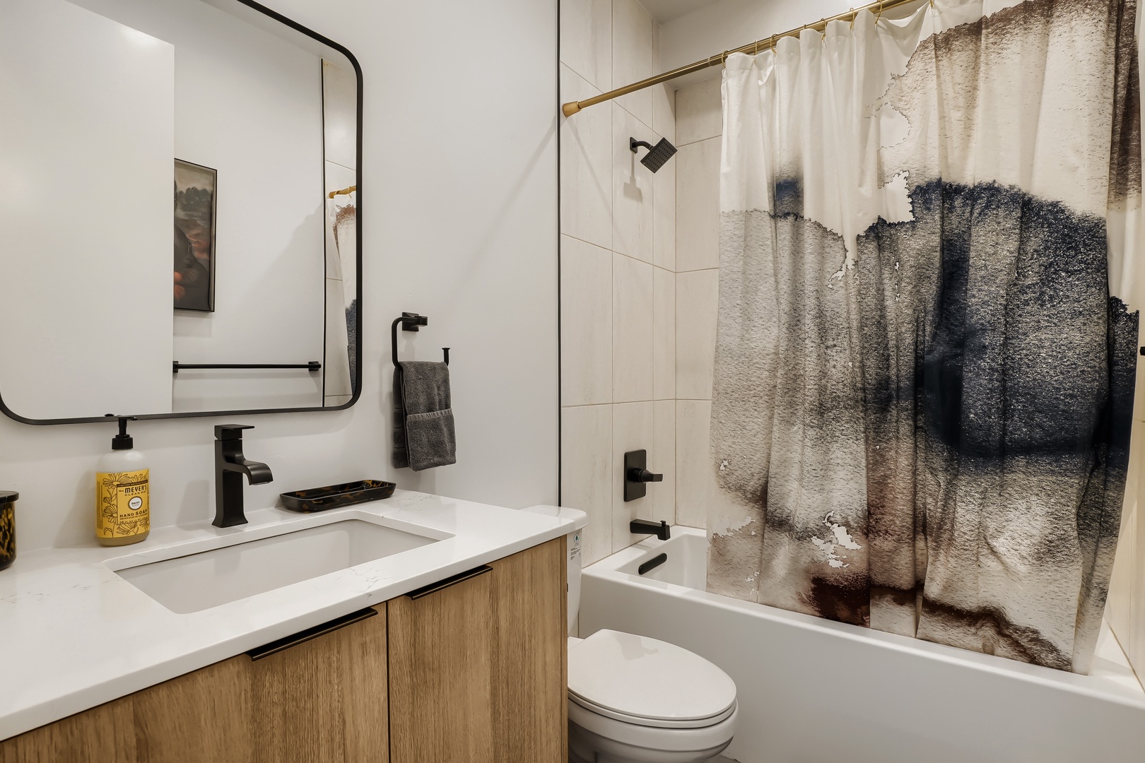 Unwind in this modern bathroom with its sleek fixtures and spa-like shower, designed to help you relax and recharge after your adventures.