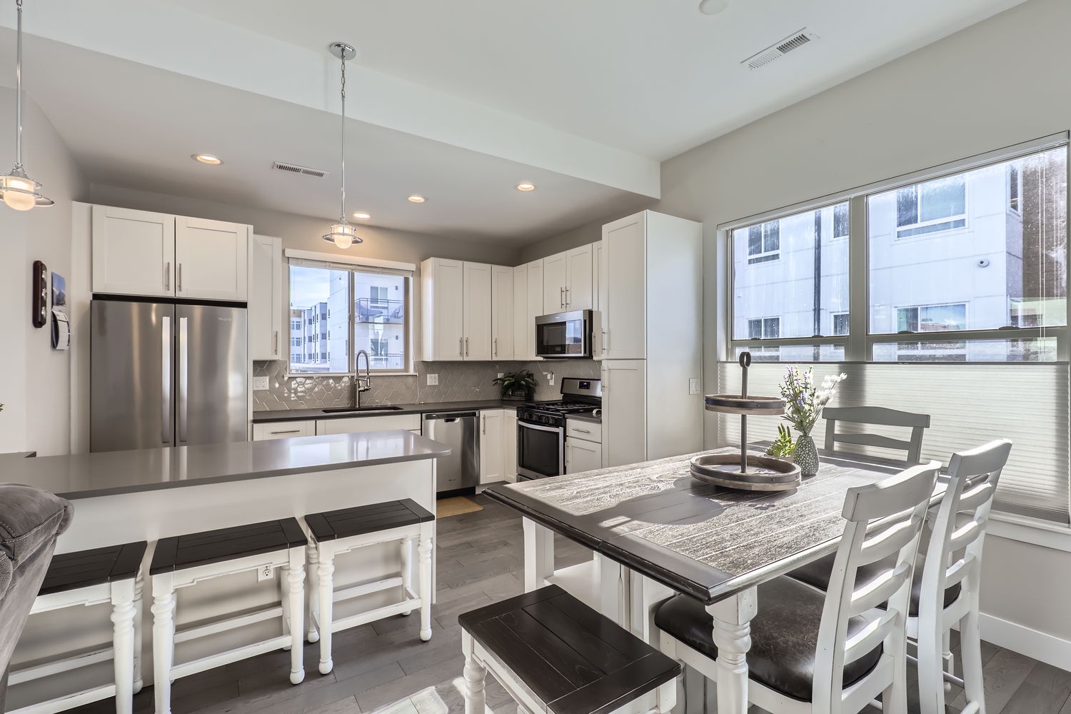 Cook up memories in this bright, fully-equipped kitchen with stainless appliances and a welcoming dining area—perfect for family meals or morning coffee.