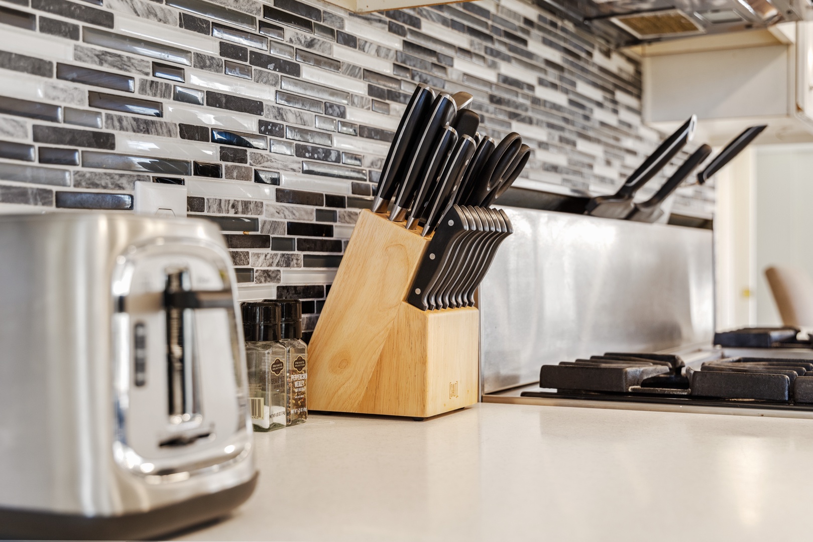 Your fully equipped kitchen awaits with professional knife set and marble countertops, perfect for creating memorable meals during your stay.