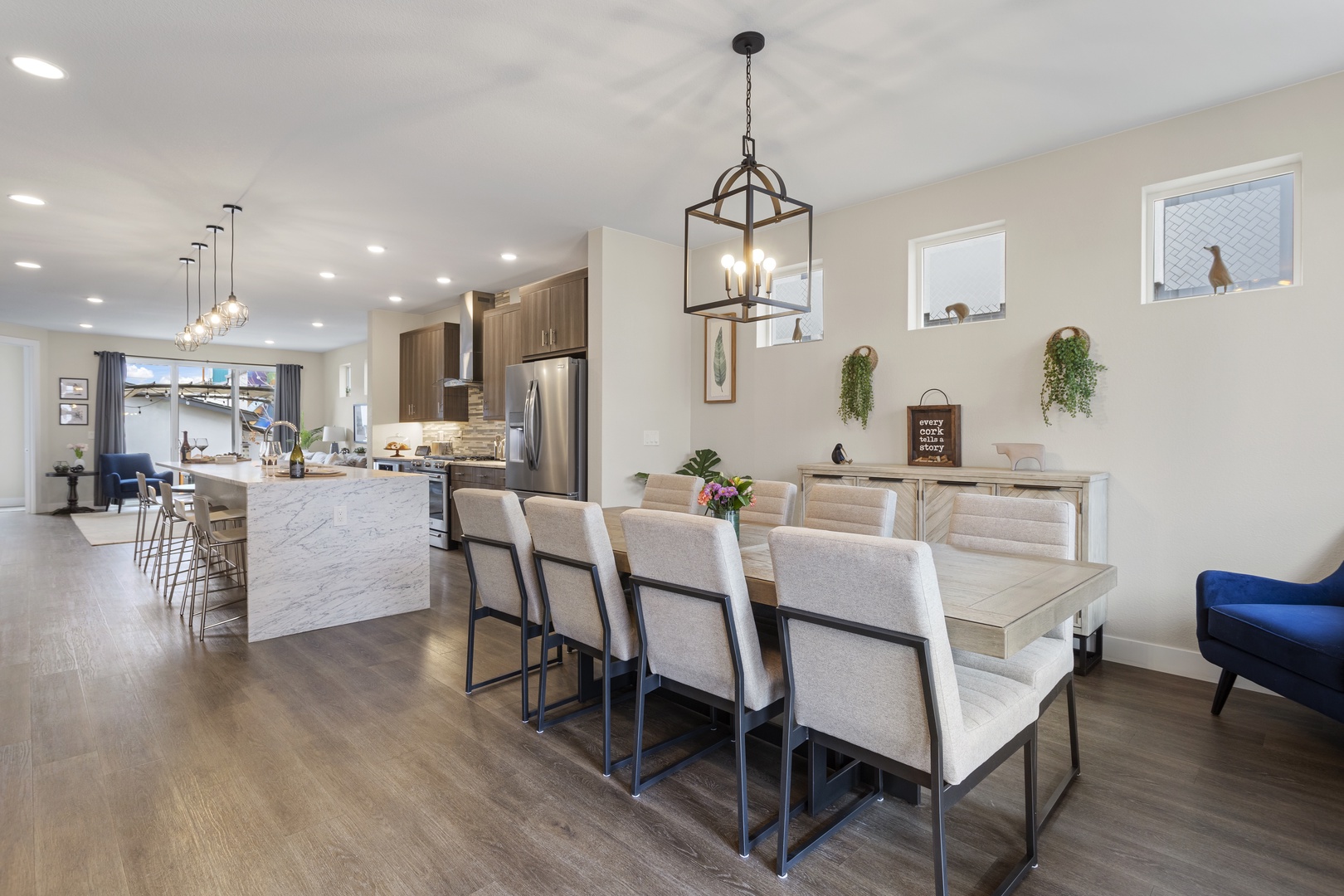 Gather around this inviting dining space where you'll share memorable meals with loved ones in elegant comfort.