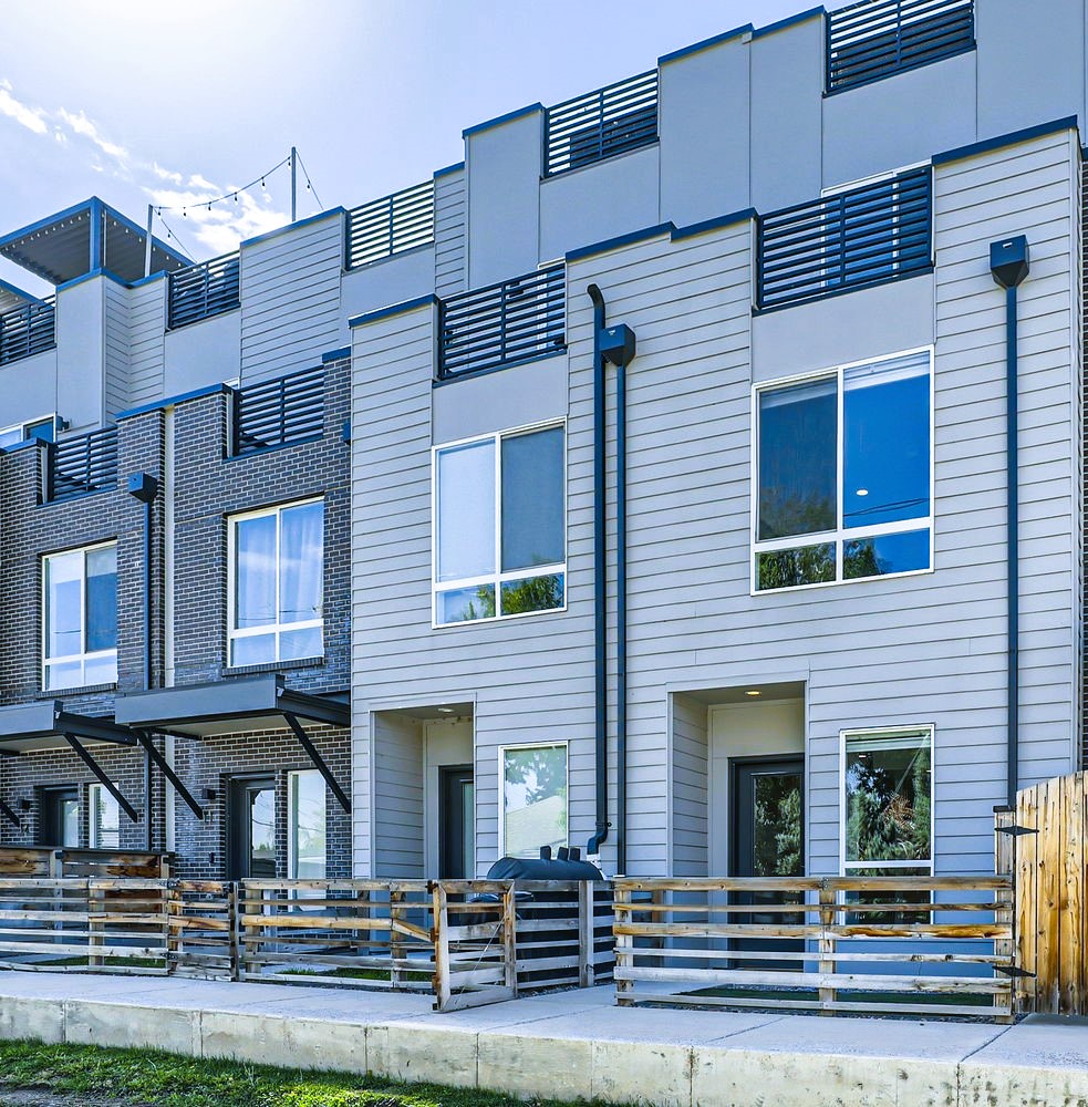 Modern townhome community featuring contemporary architecture with mixed materials and clean lines.