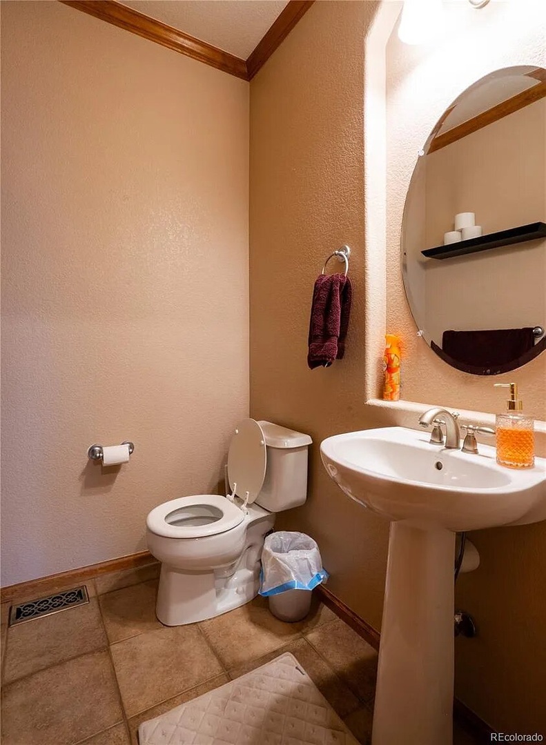 Your private bathroom features thoughtful touches with warm lighting, plush towels, and modern fixtures for your comfort.