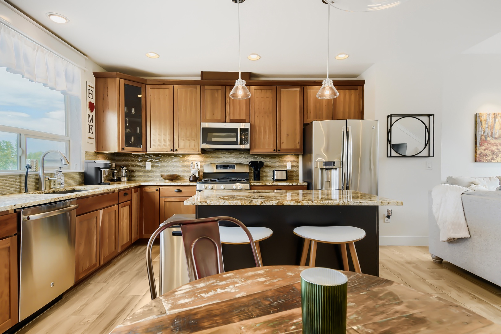 Cook your favorite meals in this fully equipped kitchen featuring granite countertops, stainless steel appliances, and a breakfast bar where you can enjoy casual dining with loved ones.