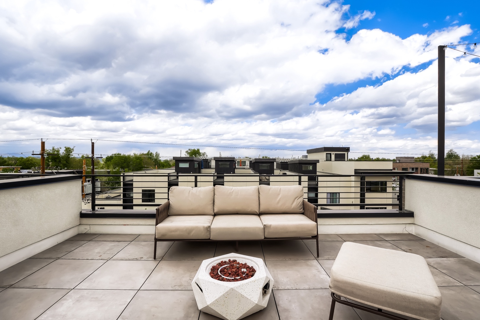 Catch the sunrise from your private rooftop terrace, where plush seating and open skies create the perfect spot for morning coffee or evening relaxation above it all.