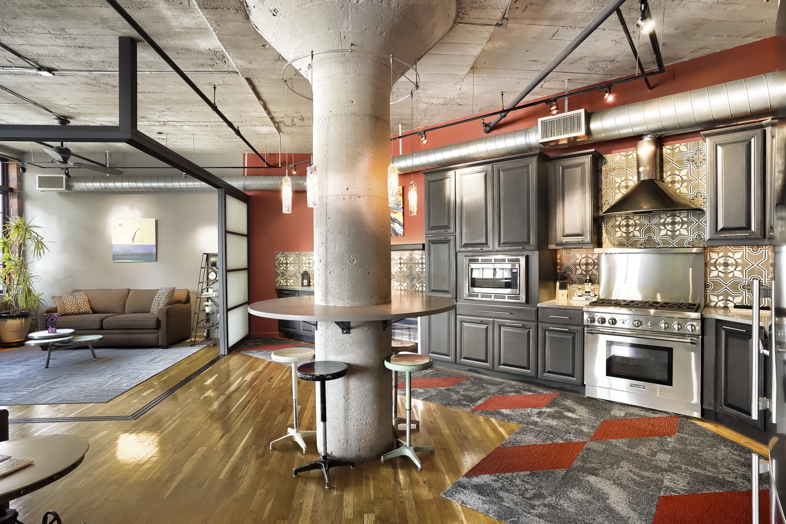 Step into your stylish urban loft where industrial charm meets modern comfort. Enjoy cooking in the fully equipped chef's kitchen, then unwind in the open living space bathed in natural light.